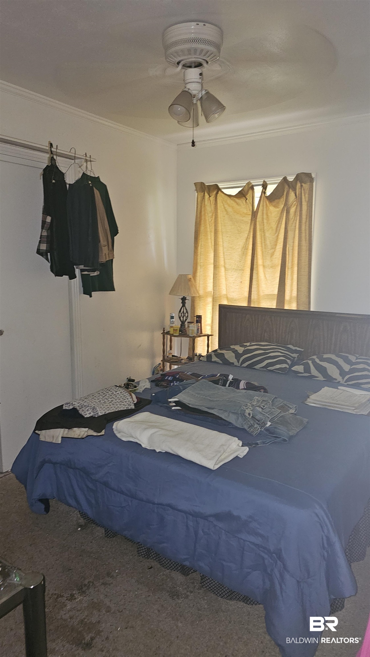 216 6th Avenue Atmore, AL 36502 - Photo 17 of 34 Carpeted bedroom featuring crown molding and ceiling fan