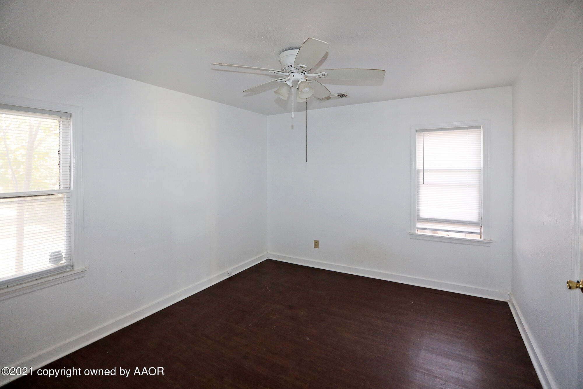 3603 South Ong Street Amarillo, TX 79110 - Photo 7 of 13 an empty room with a window and a fan