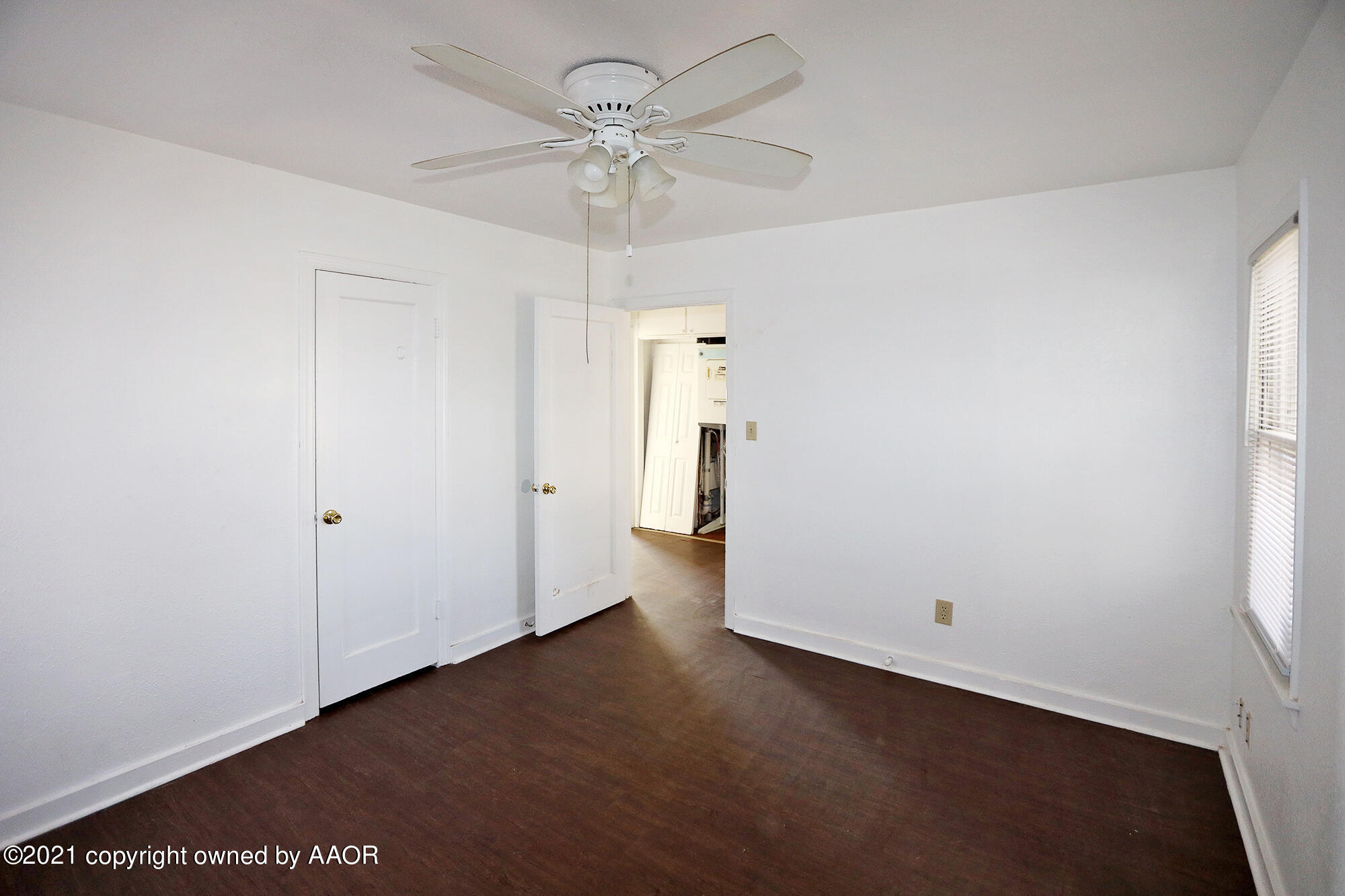 3603 South Ong Street Amarillo, TX 79110 - Photo 8 of 13 an empty room with a empty space and a ceiling fan