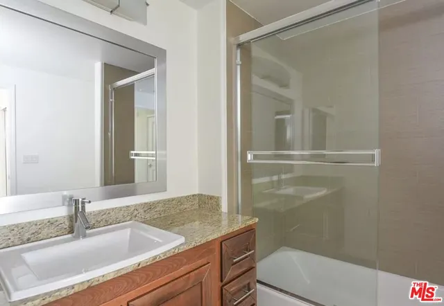 a utility room with closet dryer and washer
