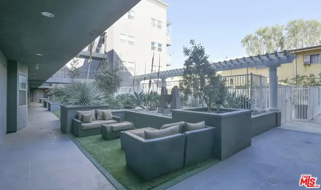 a view of a terrace with couches and table