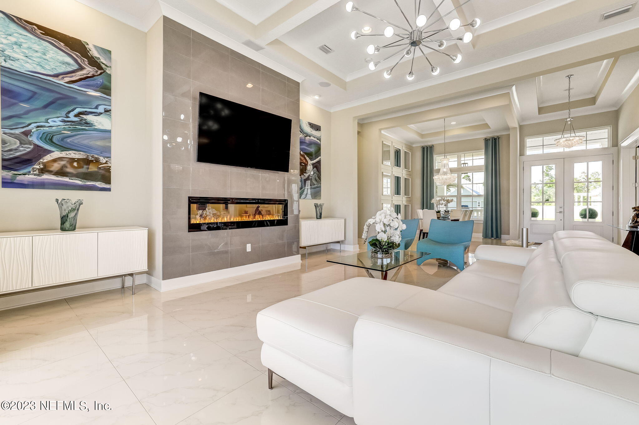 300 Topside Drive St. Johns, FL 32259 - Photo 18 of 121 a living room with furniture a flat screen tv and a chandelier