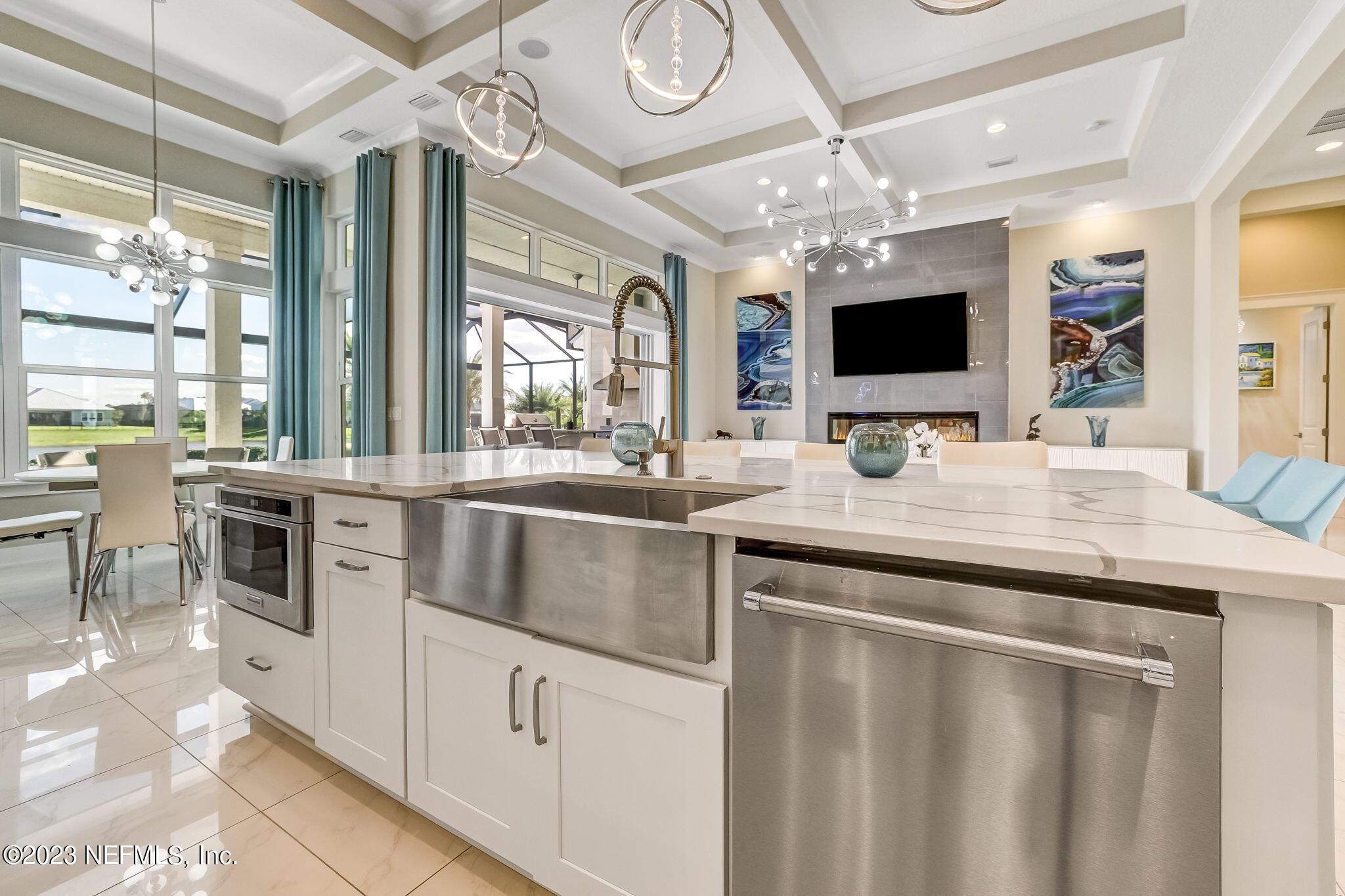 300 Topside Drive St. Johns, FL 32259 - Photo 21 of 121 a kitchen with stainless steel appliances a stove a microwave and white cabinets