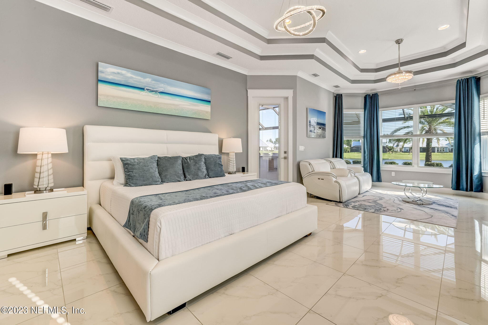 300 Topside Drive St. Johns, FL 32259 - Photo 32 of 121 a spacious bedroom with a large bed and a chandelier