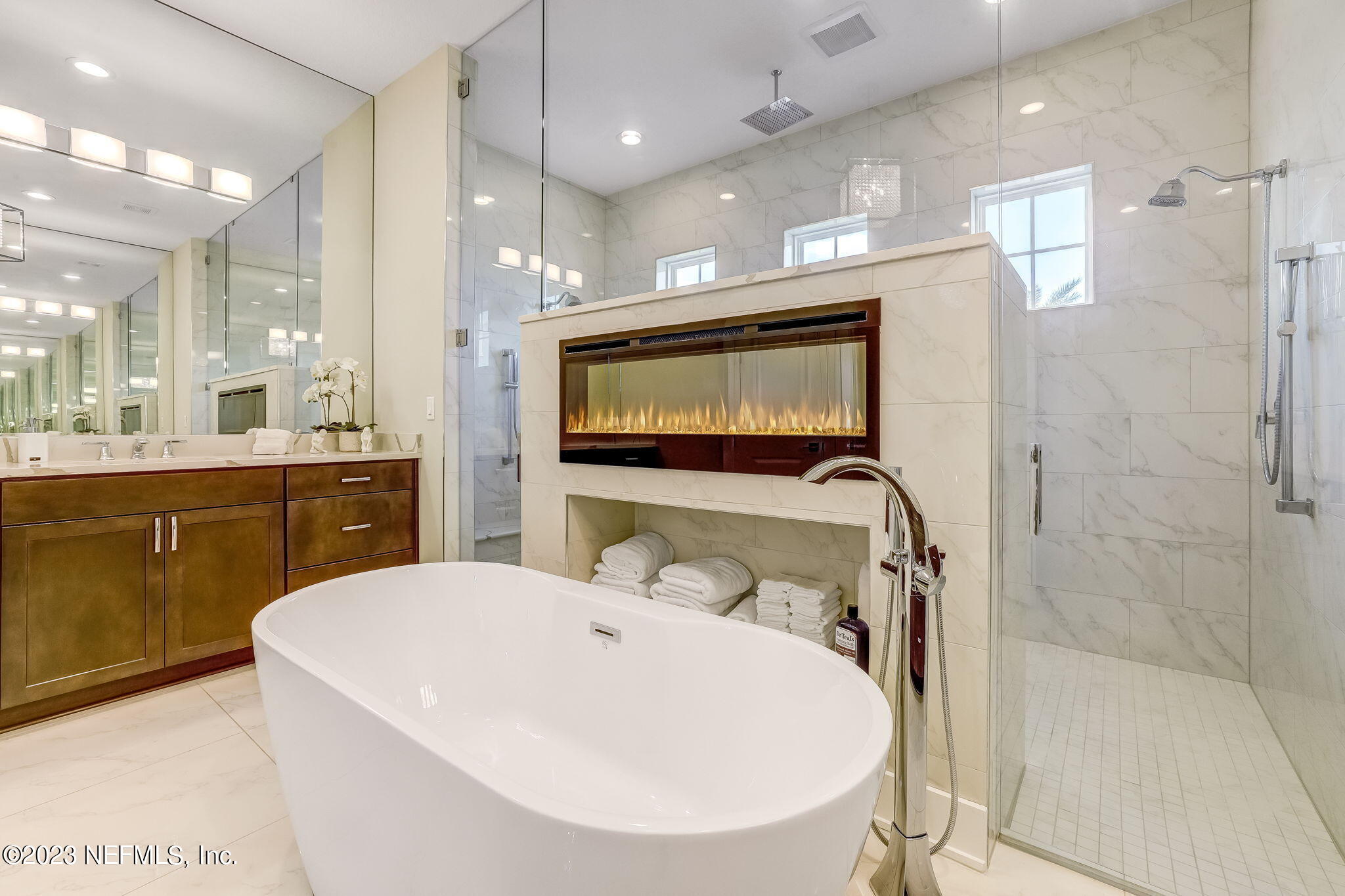 300 Topside Drive St. Johns, FL 32259 - Photo 38 of 121 a en suite bathroom with a sink a large mirror and a shower