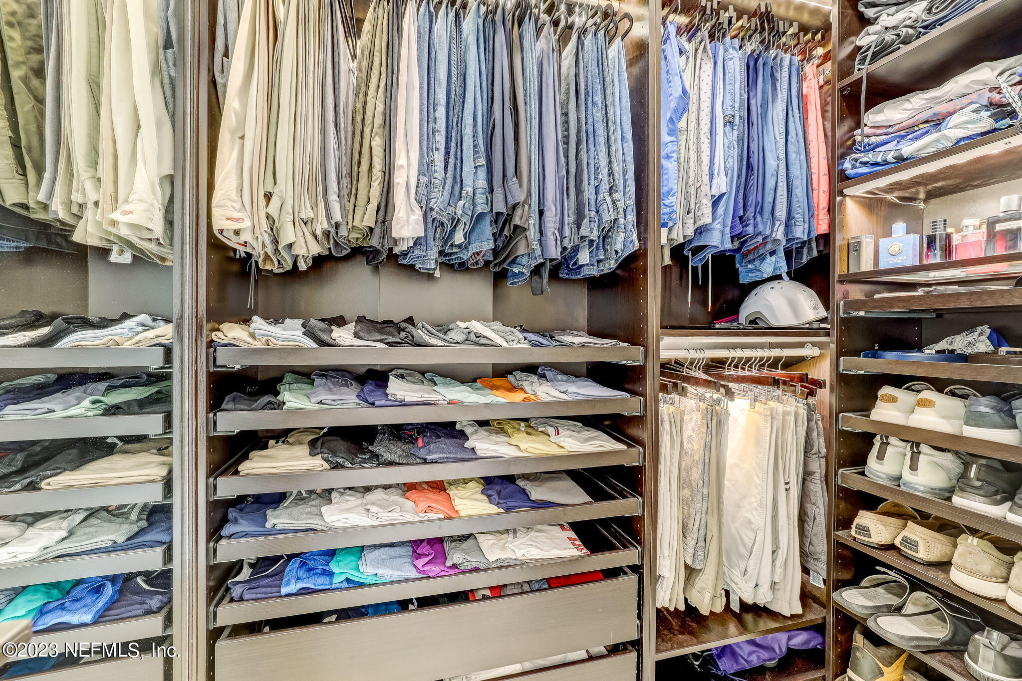 300 Topside Drive St. Johns, FL 32259 - Photo 41 of 121 a view of walk in closet with clothes and shoes