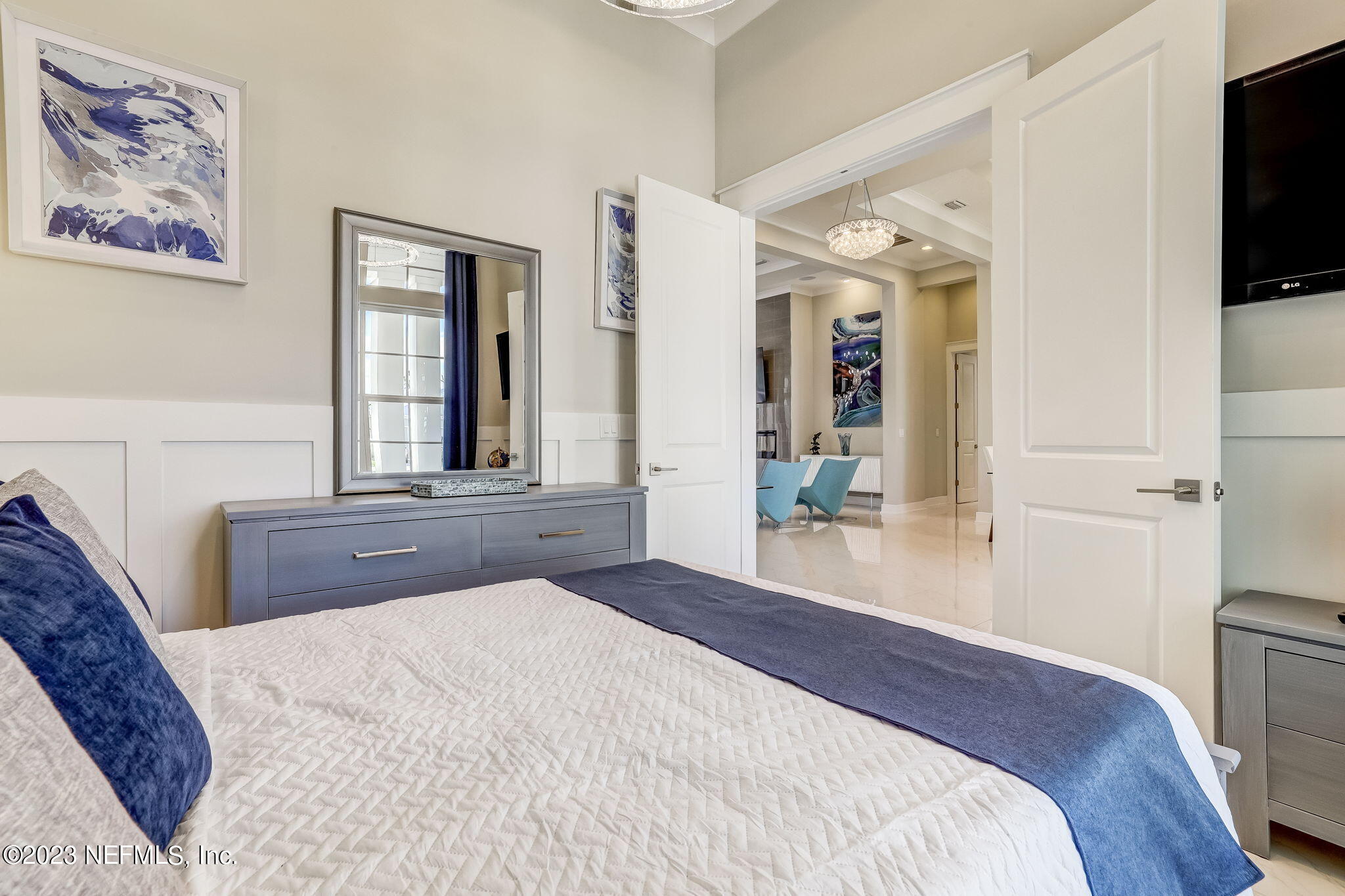 300 Topside Drive St. Johns, FL 32259 - Photo 44 of 121 a bedroom with a large bed and a flat tv screen on dresser