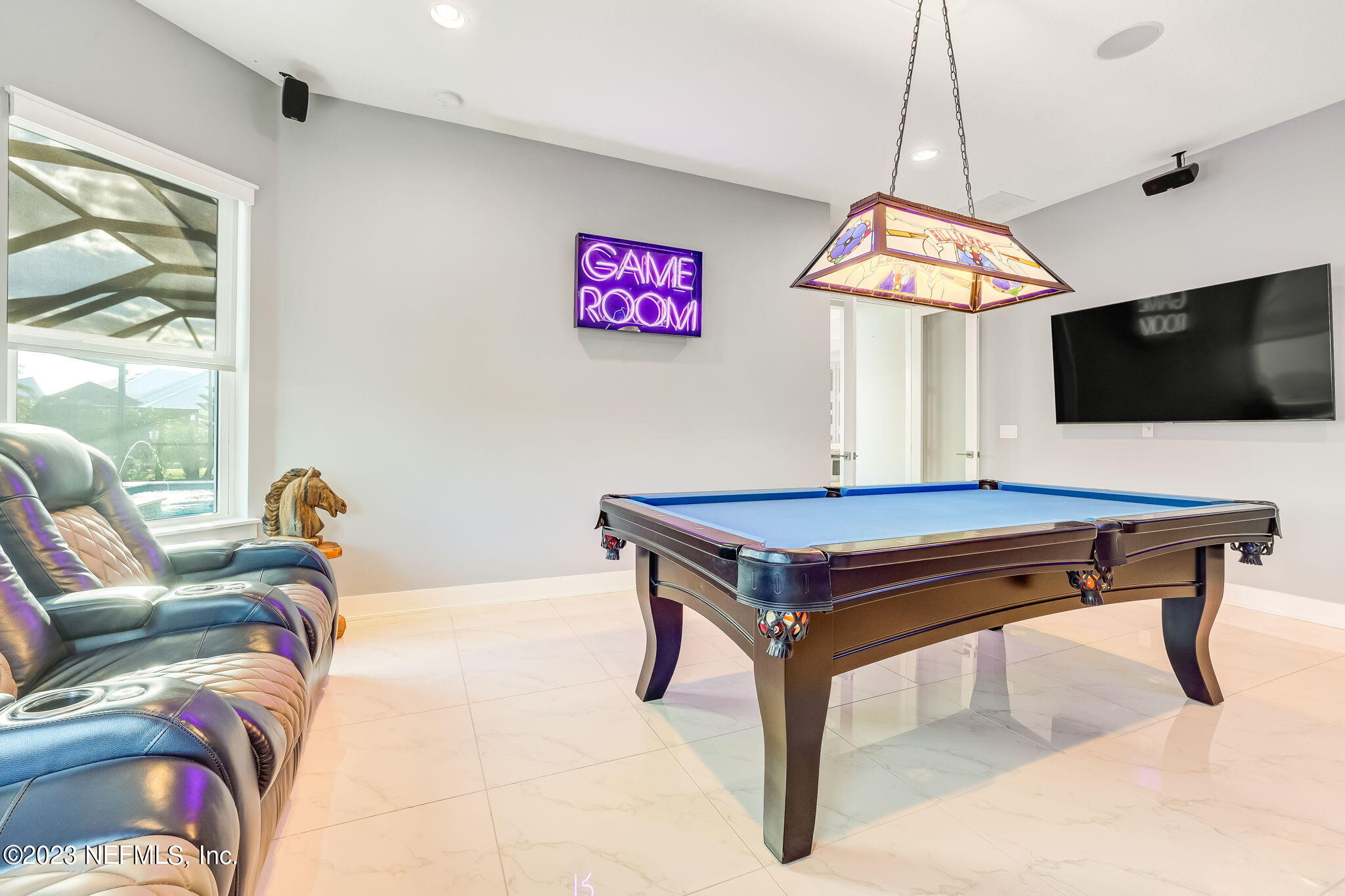 300 Topside Drive St. Johns, FL 32259 - Photo 53 of 121 a living room with furniture and a flat screen tv