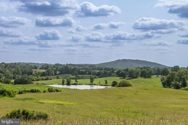 a view of a lake with mountains in the background