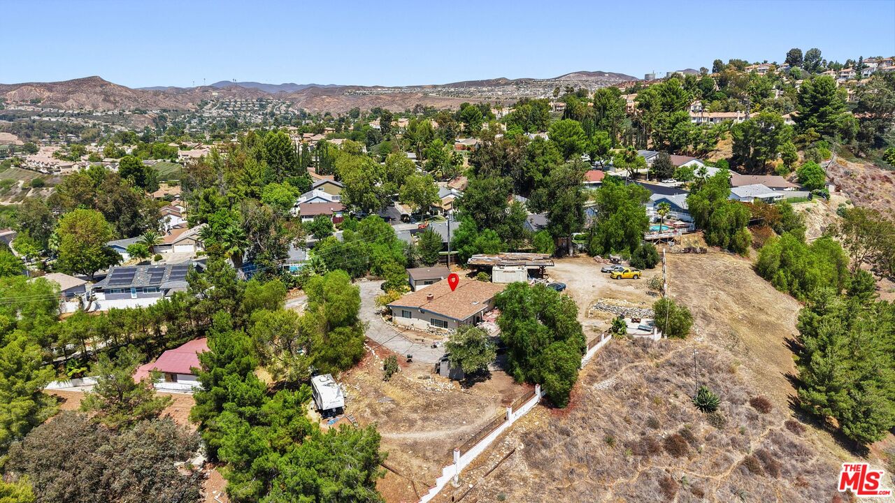 27420 Homyr Place Canyon Country, CA 91351 - Photo 4 of 8 an aerial view of residential house with parking and trees