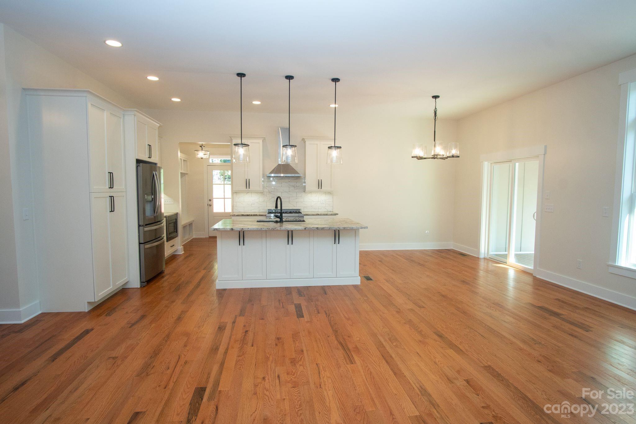 1495 Golf Course Road Columbus, NC 28722 - Photo 17 of 47 a view of a kitchen with wooden floor
