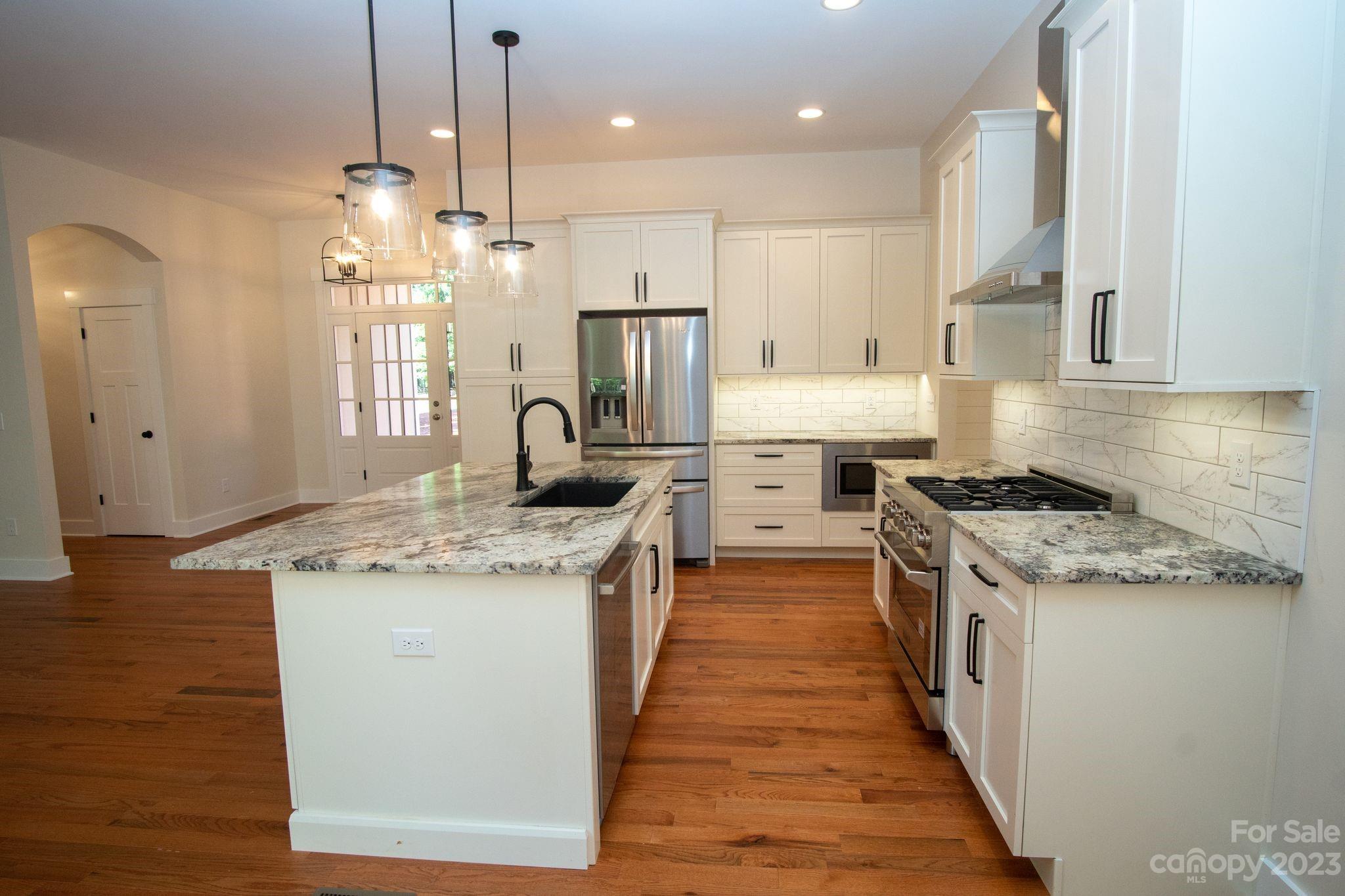 1495 Golf Course Road Columbus, NC 28722 - Photo 18 of 47 a kitchen with a stove oven and sink