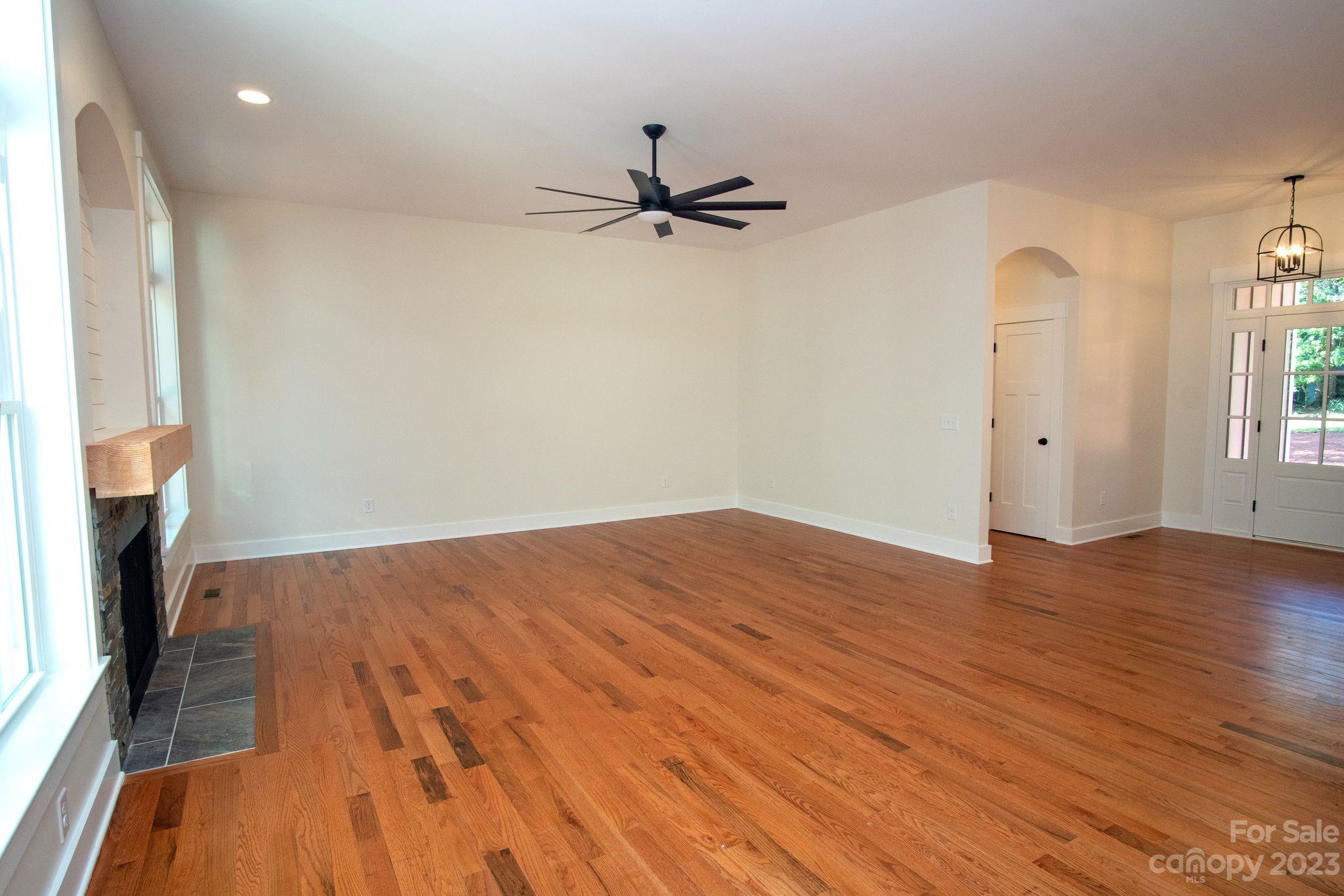 1495 Golf Course Road Columbus, NC 28722 - Photo 20 of 47 wooden floor in an empty room with a window