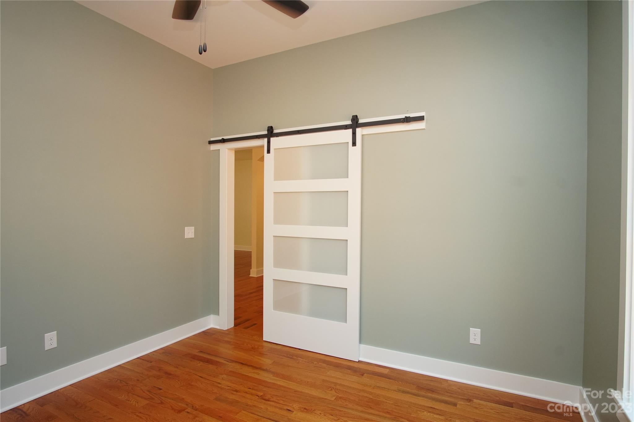 1495 Golf Course Road Columbus, NC 28722 - Photo 26 of 47 a view of an empty room with wooden floor