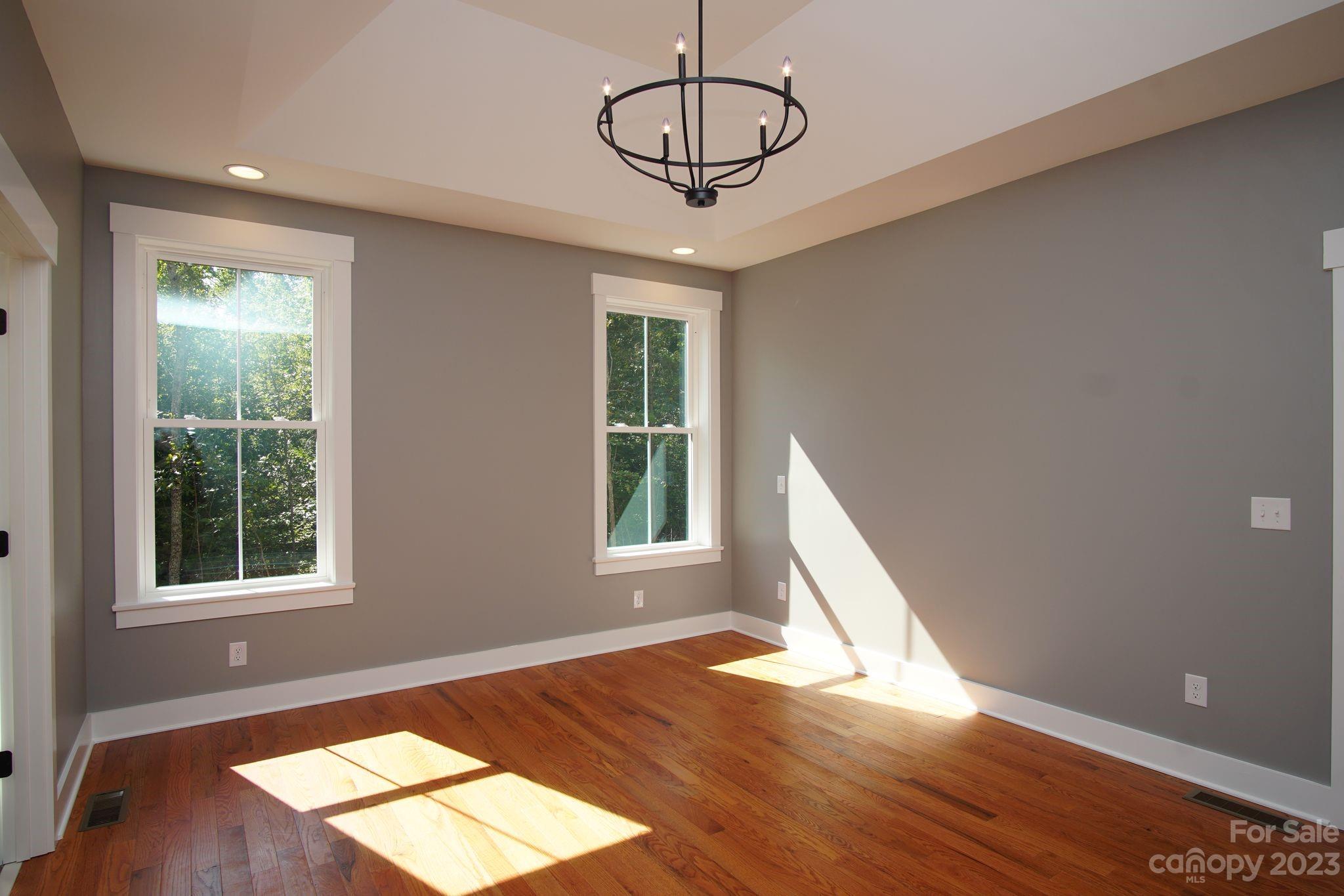 1495 Golf Course Road Columbus, NC 28722 - Photo 28 of 47 a view of an empty room with wooden floor and window