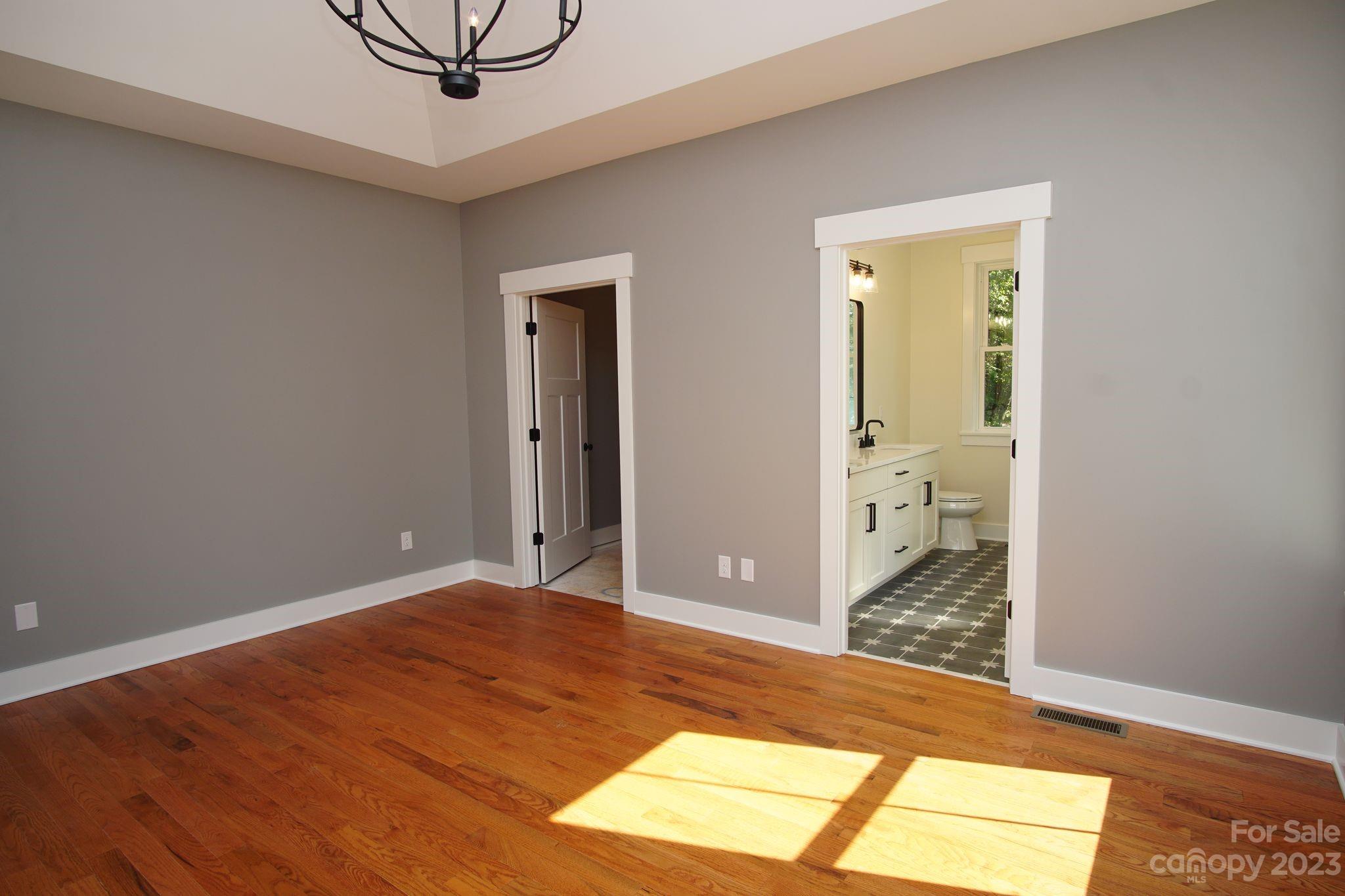 1495 Golf Course Road Columbus, NC 28722 - Photo 29 of 47 a view of a room with wooden floor and bathroom