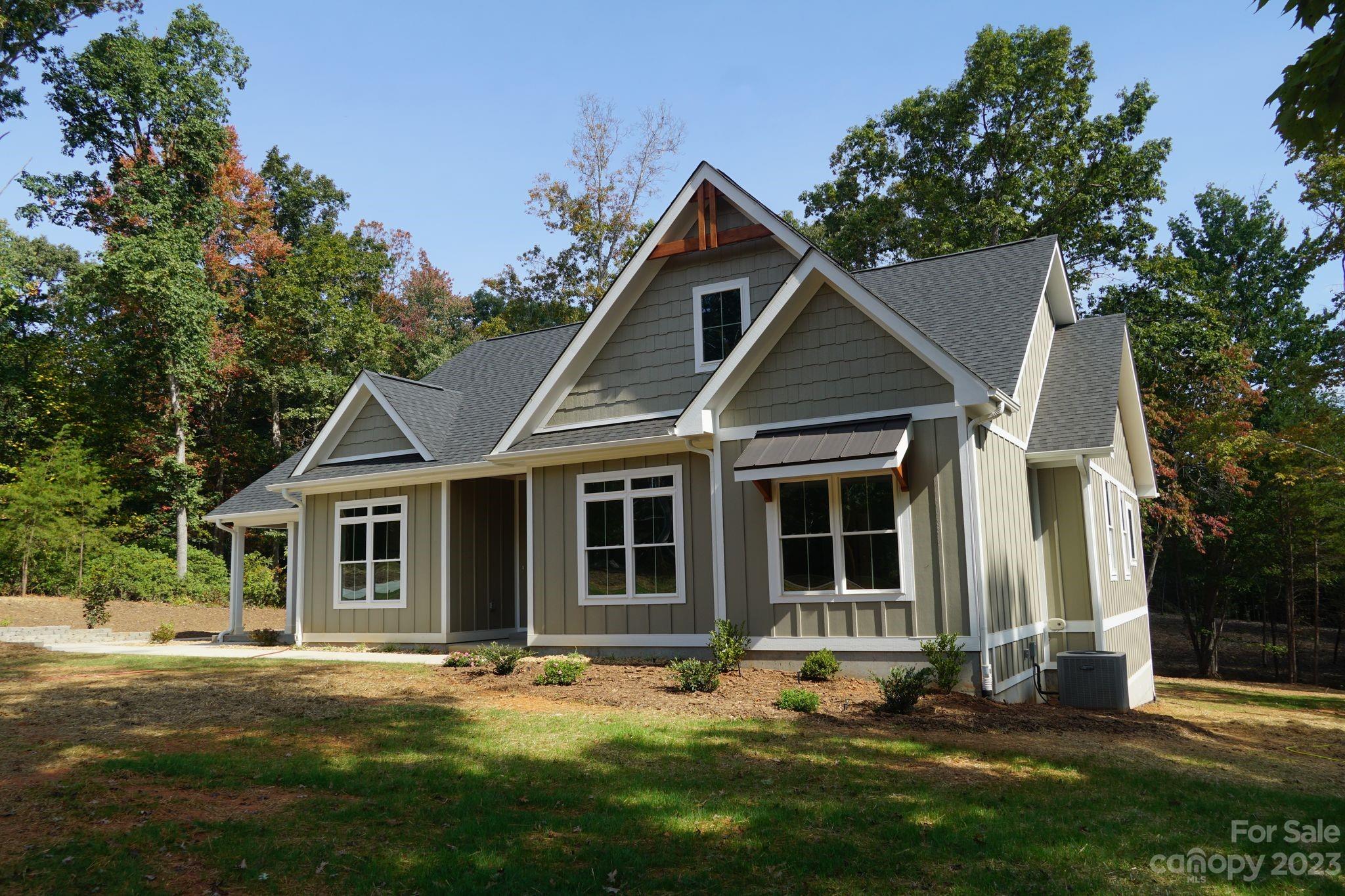 1495 Golf Course Road Columbus, NC 28722 - Photo 3 of 47 front view of a house with a yard