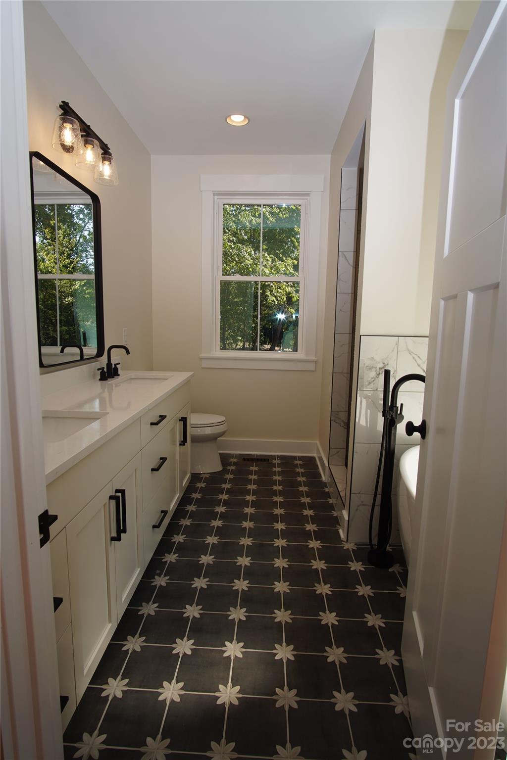 1495 Golf Course Road Columbus, NC 28722 - Photo 31 of 47 a bathroom with a sink and a window