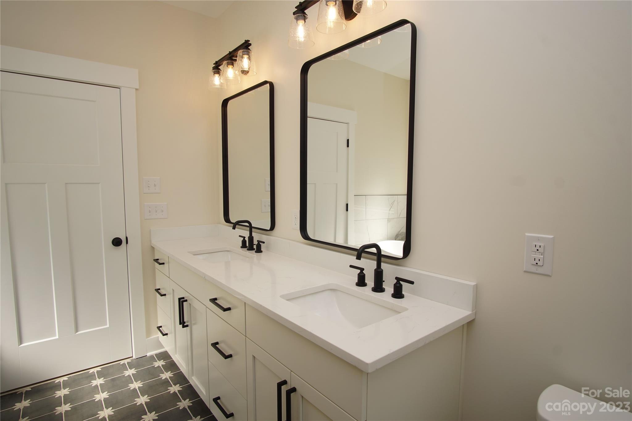1495 Golf Course Road Columbus, NC 28722 - Photo 34 of 47 a bathroom with a sink and a mirror
