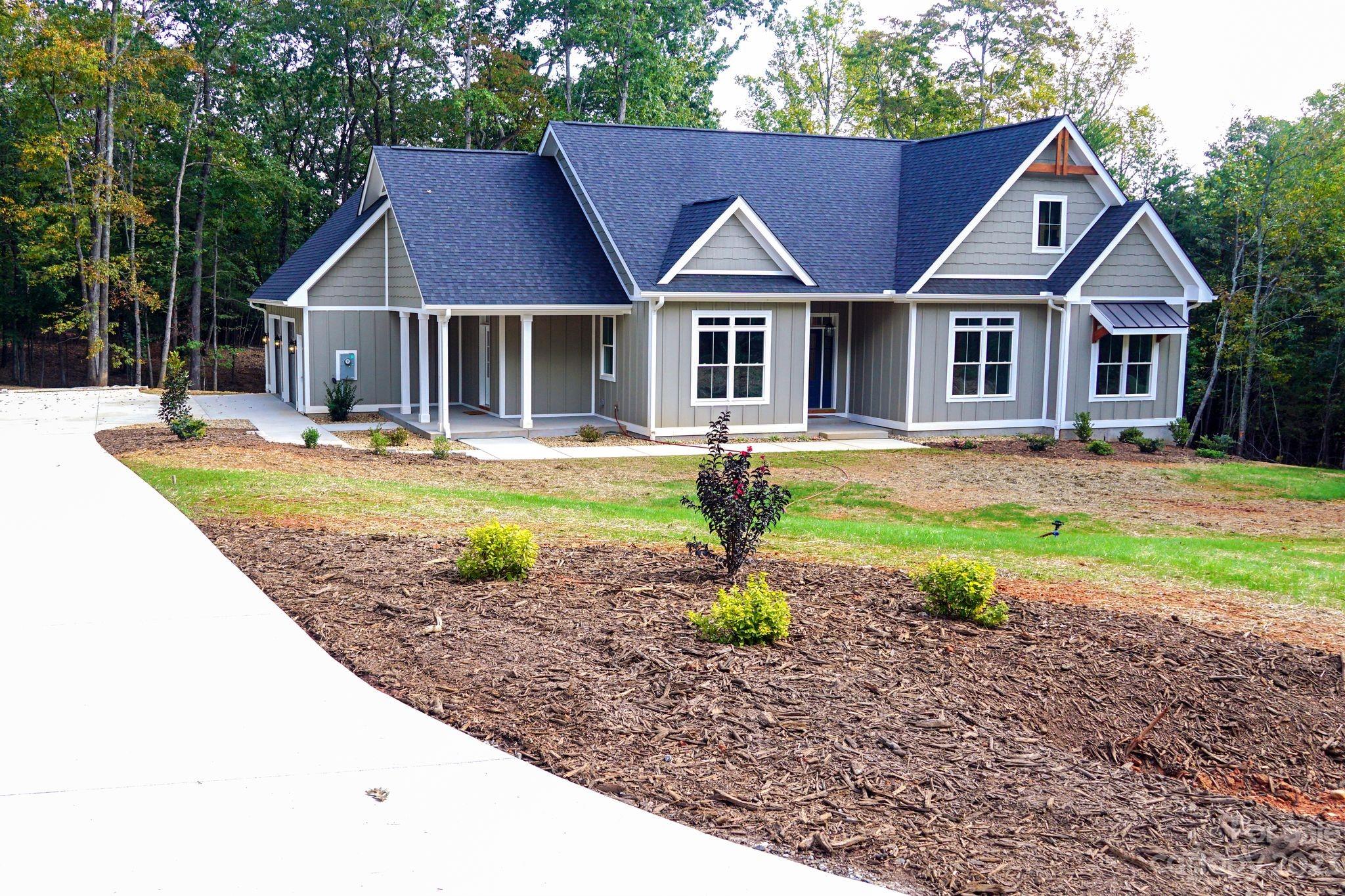 1495 Golf Course Road Columbus, NC 28722 - Photo 4 of 47 a front view of house with yard and green space