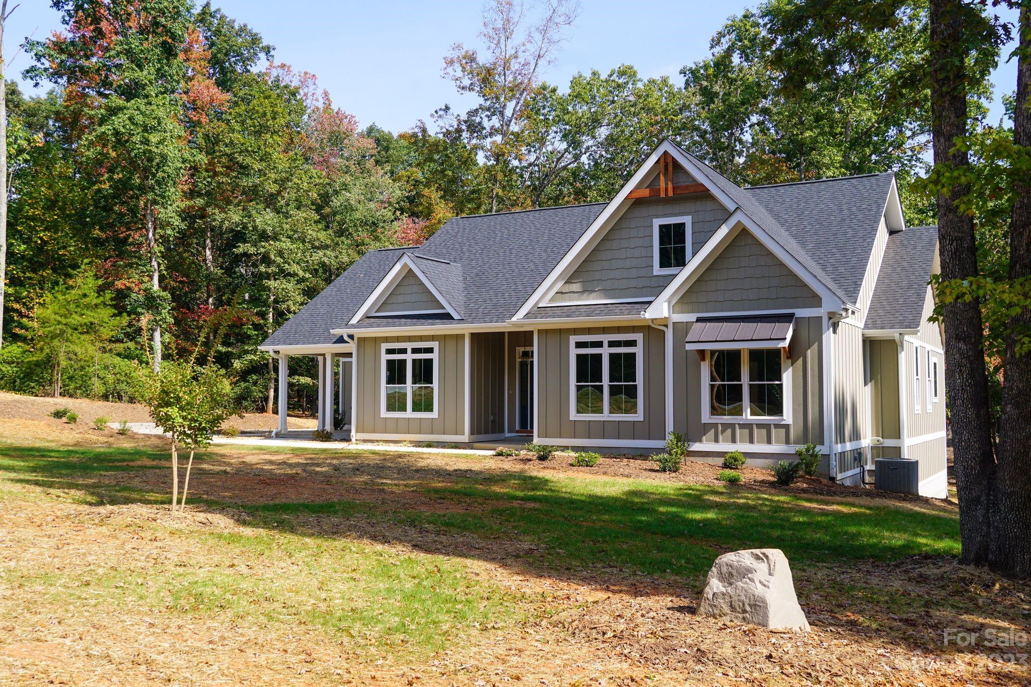 1495 Golf Course Road Columbus, NC 28722 - Photo 6 of 47 a front view of house with yard and green space