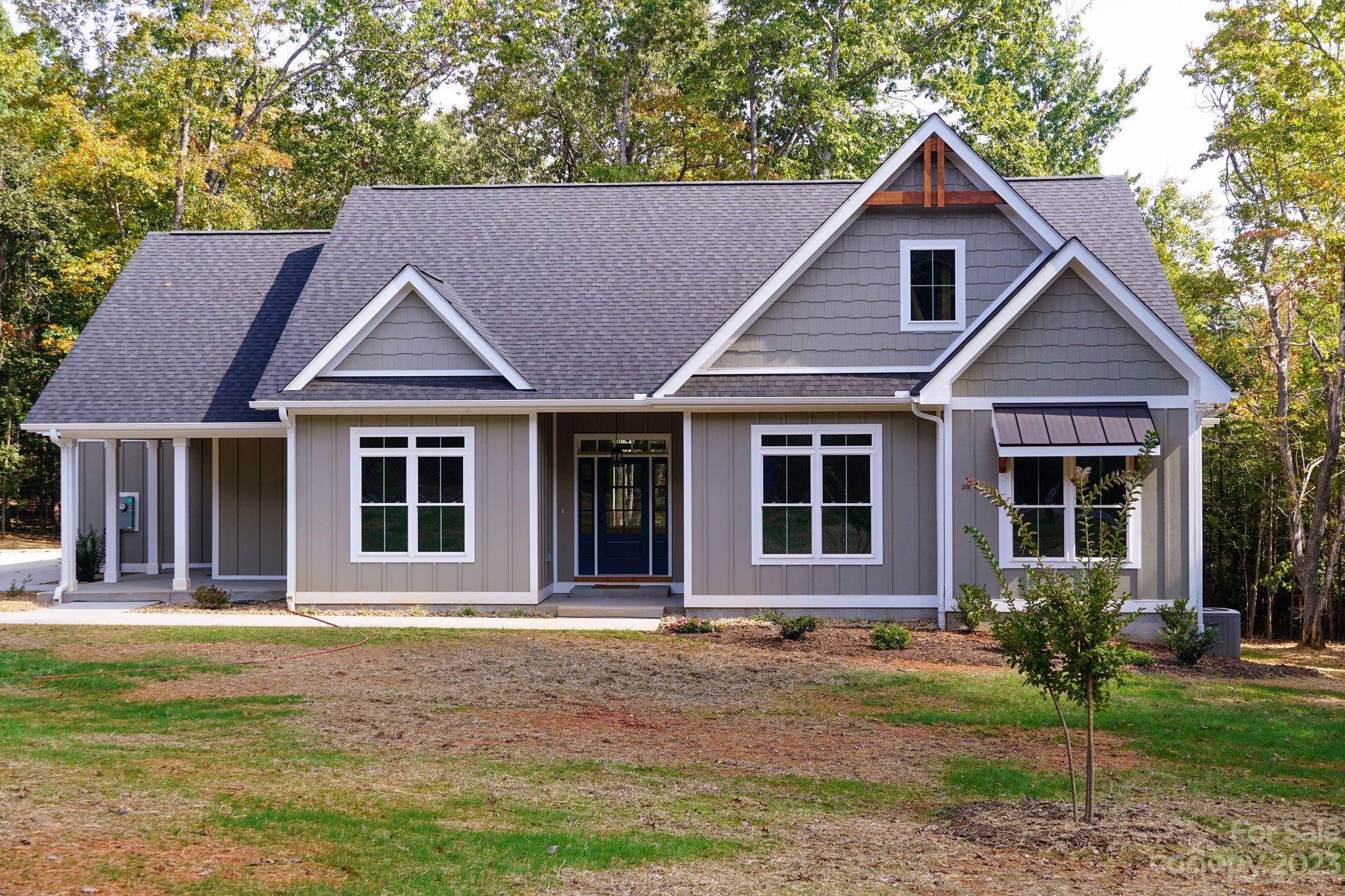 1495 Golf Course Road Columbus, NC 28722 - Photo 7 of 47 a front view of a house with a yard