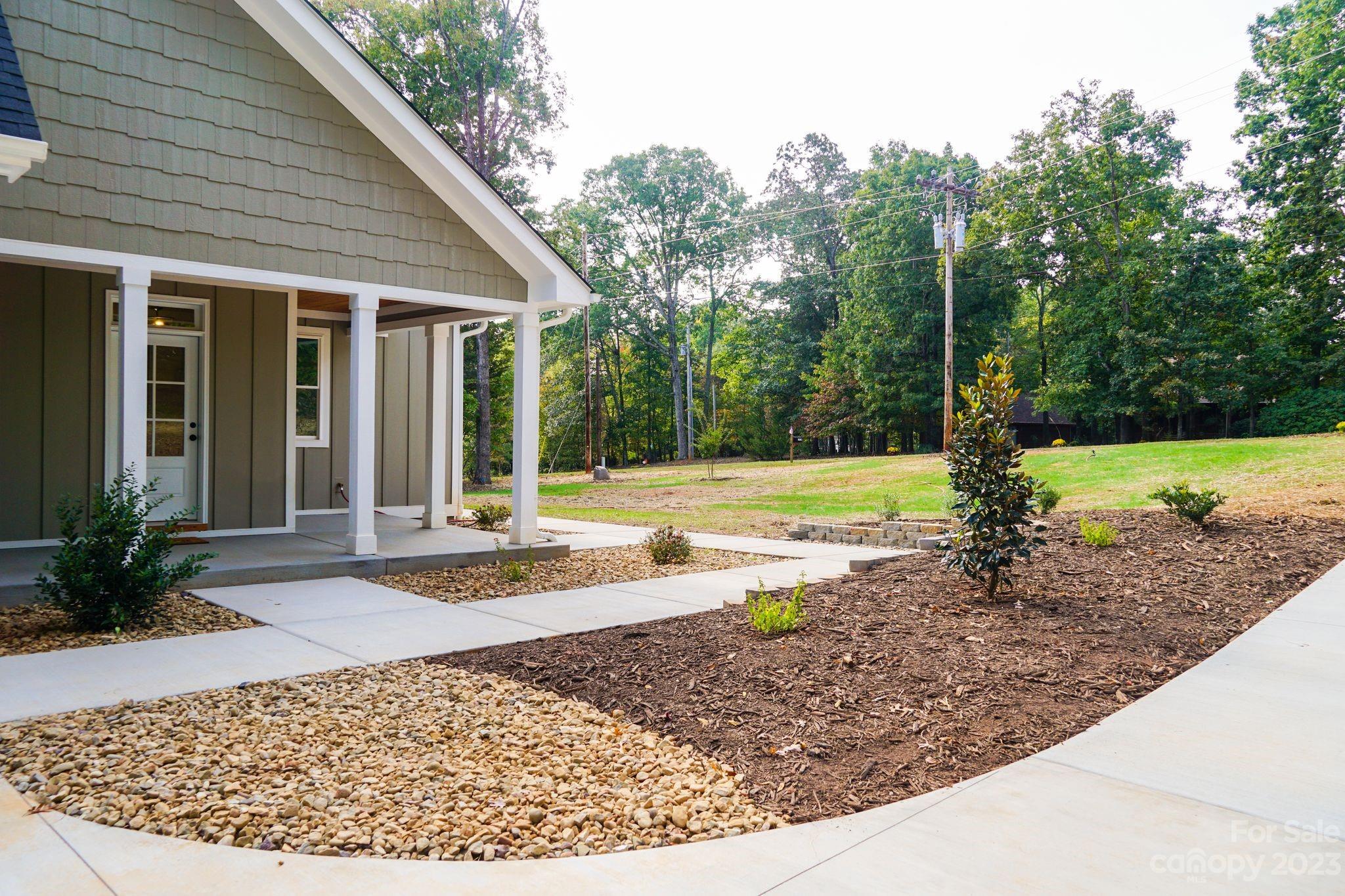 1495 Golf Course Road Columbus, NC 28722 - Photo 8 of 47 a view of a house with backyard and trees