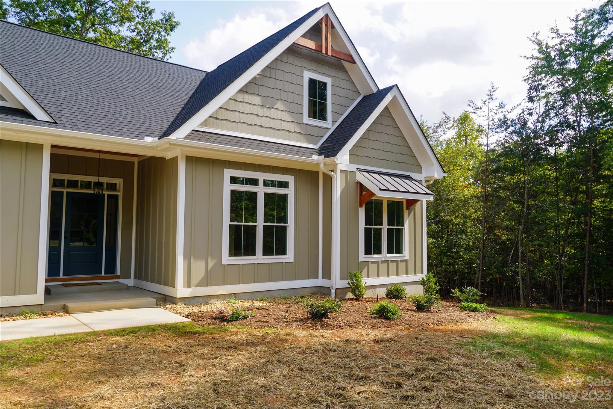 1495 Golf Course Road Columbus, NC 28722 - Photo 10 of 47 a front view of a house with a yard
