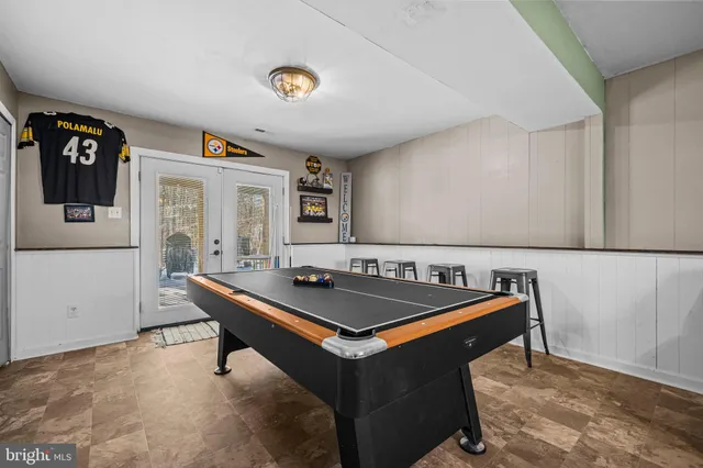 a room with gym equipment and a table