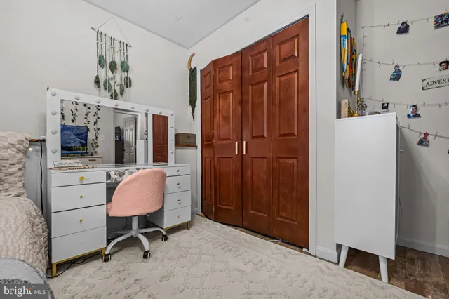 a view of a workspace with furniture and a dresser