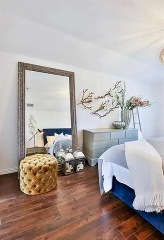 a bedroom with two beds and a large window