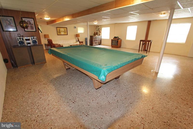 412 Whitaker Mill Road Fallston, MD 21047 - Photo 20 of 25 a living room with furniture pool table and a large window