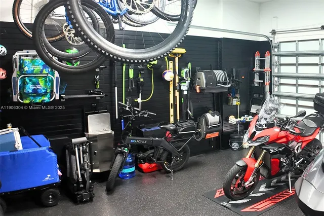 a room with a washing machine and potted plants