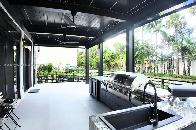 a living room with furniture and a floor to ceiling window