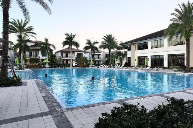 a view of a swimming pool with a house