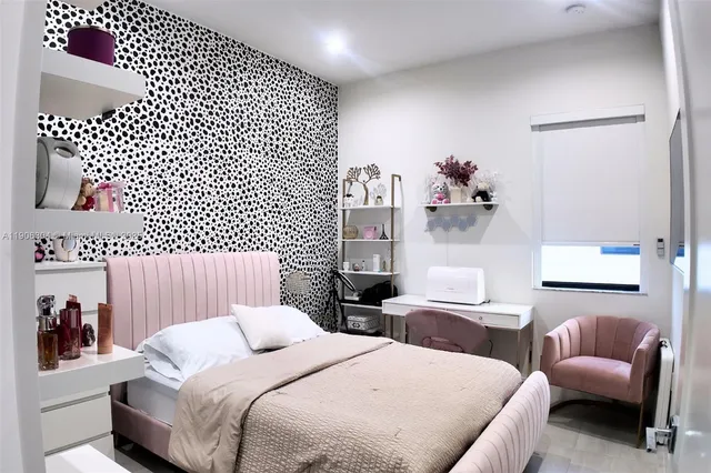 a bedroom with two beds and a couch