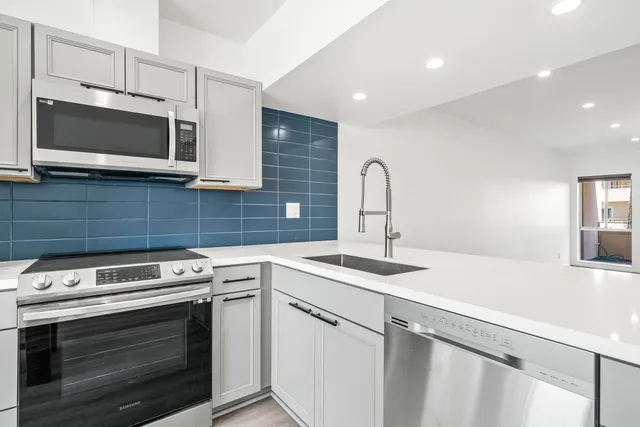 a kitchen with a stove and a microwave