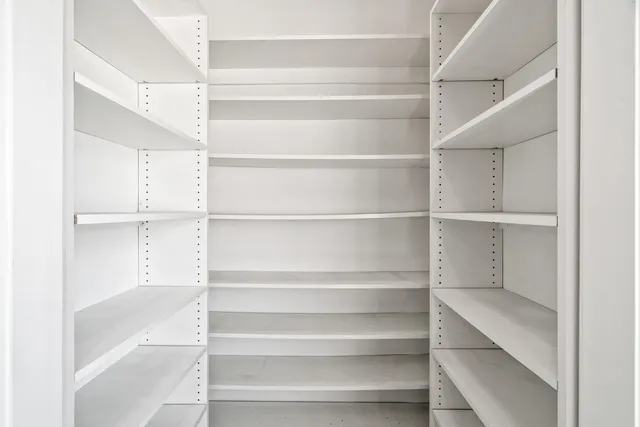 a kitchen with kitchen island a stove a sink and a refrigerator