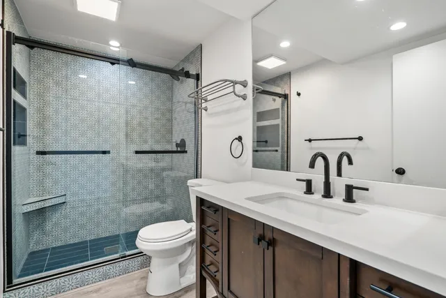 a view of a patio with couches and potted plants