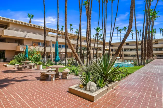 a view of a patio with a table and chairs