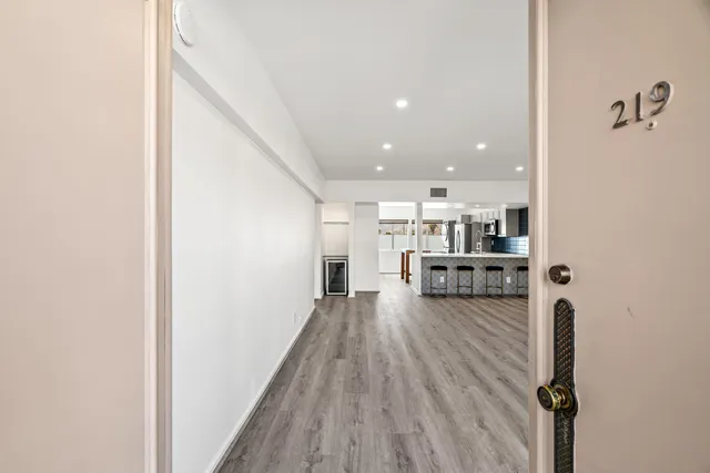 a view of kitchen with furniture and wooden floor