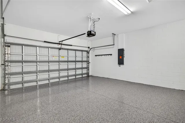 a view of a storage & utility room with refrigerator