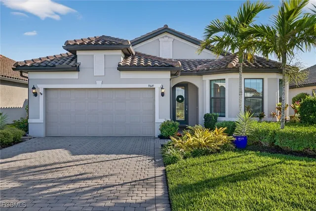 a aerial view of a house with a yard