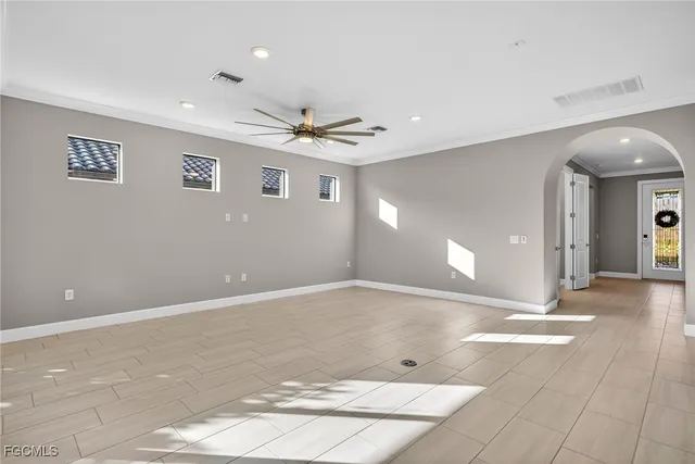 a view of a livingroom with a ceiling fan and window