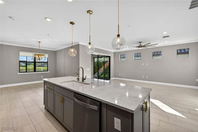 a very nice looking kitchen with a large island