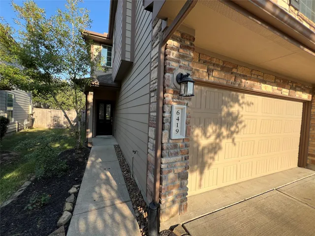a view of a hallway with windows