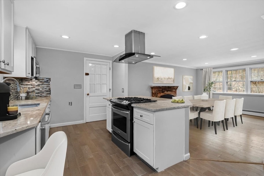 346 Long Hill Road Bolton, MA 01740 - Photo 3 of 12 a kitchen with a stove cabinets and wooden floor