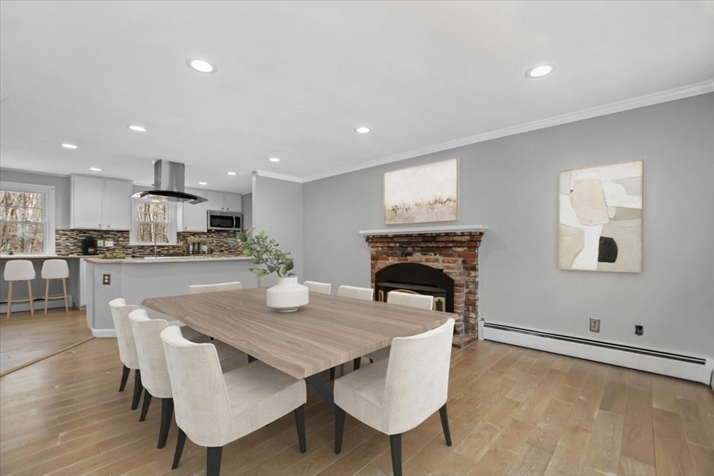 346 Long Hill Road Bolton, MA 01740 - Photo 4 of 12 a open kitchen with a table and chairs in it