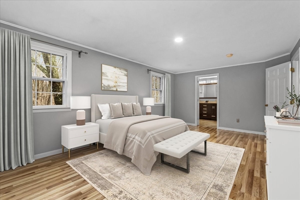 346 Long Hill Road Bolton, MA 01740 - Photo 7 of 12 a spacious bedroom with a bed and glass windows