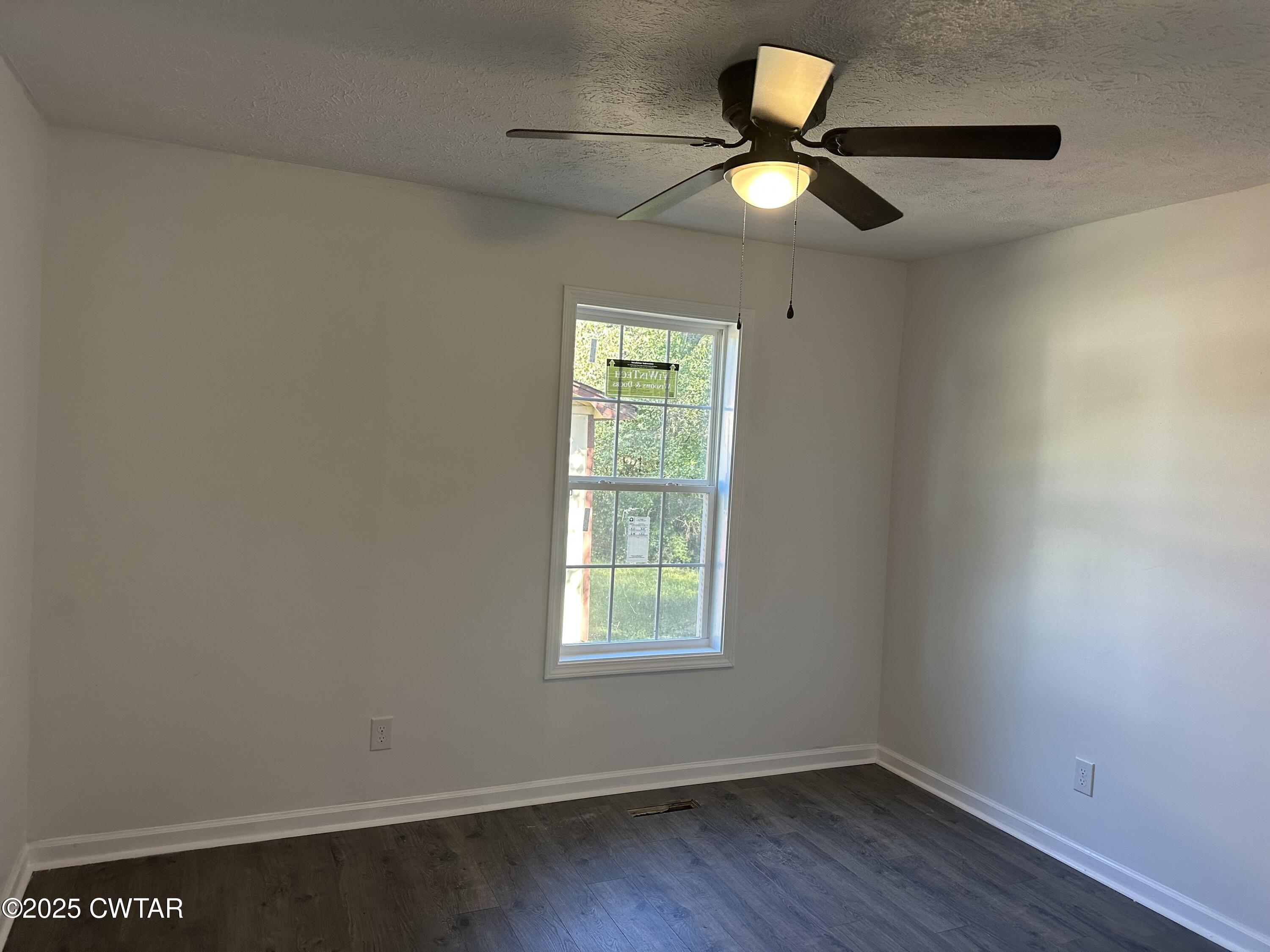 328 Baughn Street Henderson, TN 38340 - Photo 13 of 16 a window in an empty room